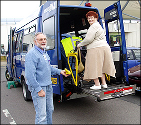 Gloucester Dial-a-Ride passenger using the tail lift supported by a passenger assistant